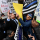 Competing protesters rally in Chicago against and for prosecutor Kim Foxx.